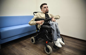 Putin’s Toughest Online Critic Brings His Name and Wheelchair Into the Light